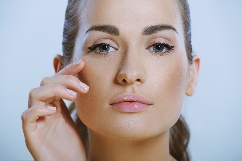 Profile view of a young woman showing her pretty nose